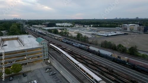 Metro rail and freight trains crossing through Doraville subway station, Atlanta, USA, Drone shot photo