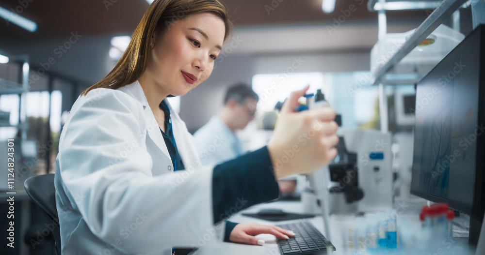 Portrait of a Beautiful Asian Female Scientist Using Micro Pipette for Medical Research Project. Advanced Scientific Lab for Medicine, Biotechnology, Microbiology Development Portrait of a Beautiful Asian Female Scientist Using Micro Pipette for Medical Research Project. Advanced Scientific Lab for Medicine, Biotechnology, Microbiology Development