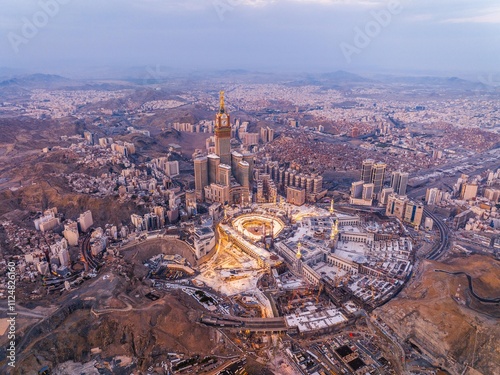 Aerial view of the Grand Mosque with the Kaaba, Islam’s holiest site, and the Abraj Al-Bait Clock Tower illuminated by early morning sunlight in the holy city of Mecca (Makkah)