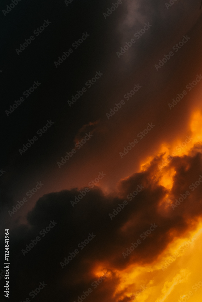 Moody storm clouds illuminated by vibrant sunset light—an inspiring backdrop for artistic or commercial use Moody storm clouds illuminated by vibrant sunset light—an inspiring backdrop for artistic or commercial use
