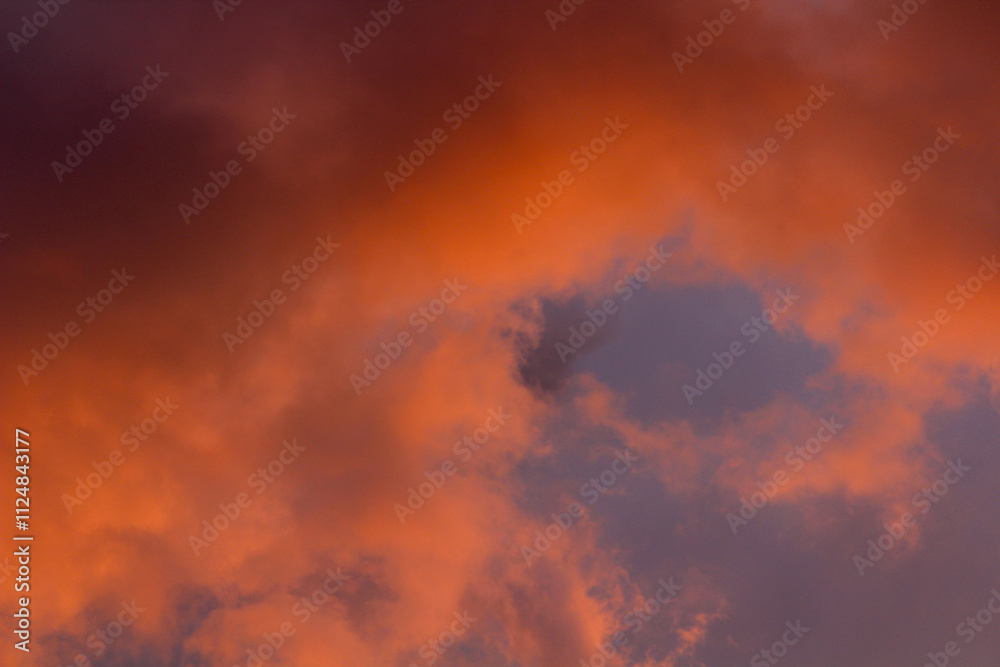 Captivating close-up of stormy skies at sunset with glowing beams of light—a striking addition to any visual design