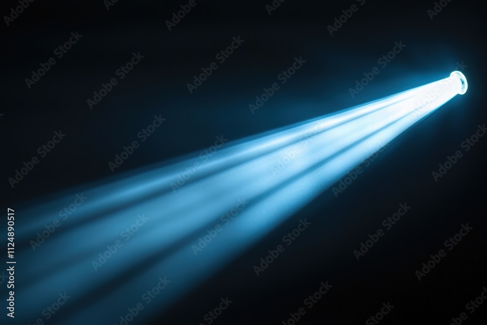 Blue spotlight beam against dark background Blue spotlight beam against dark background