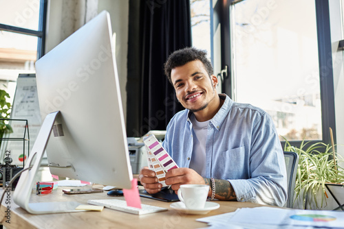 Creative professional reviewing color samples while smiling in a bright workspace photo