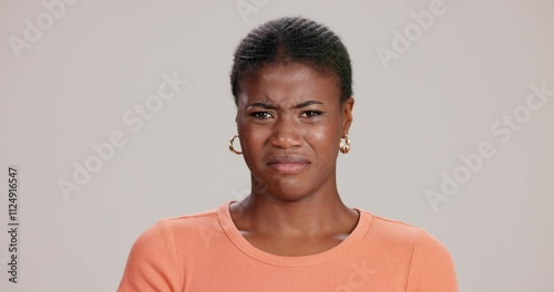 Disgust, face and gross with black woman in studio on white background for reaction to revolting repellant. Rotten, smell or stinky and unhappy person in disagreement with with awful or nasty scent