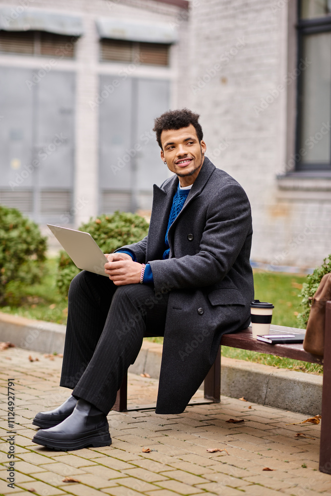 Handsome man smiles while sitting on a bench, focused on his laptop in a vibrant urban park. Handsome man smiles while sitting on a bench, focused on his laptop in a vibrant urban park.