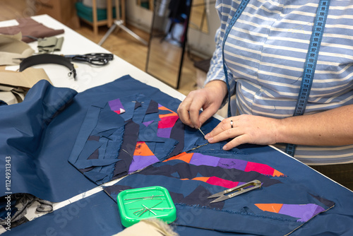 The process of sewing clothes from the remains of textiles and cut clothes. Upcycling, recycling, conscious consumption, zero waste. Youth clothing brand, sustainable fashion, reuse of materials.