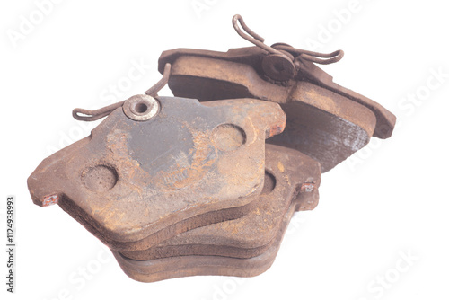 old used auto brake pads isolated on white background photo