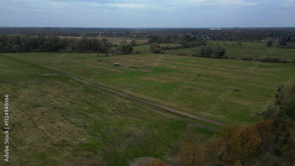Autumn woods meeting green fields cloudy sky Gorgeous aerial view flight drone Autumn woods meeting green fields cloudy sky Gorgeous aerial view flight drone
