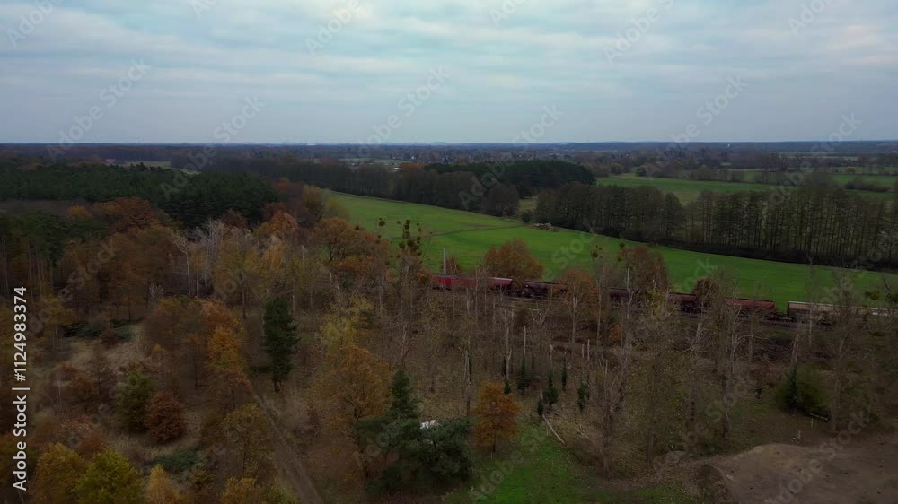 train passing green countryside in autumn. Unique aerial view flight drone train passing green countryside in autumn. Unique aerial view flight drone