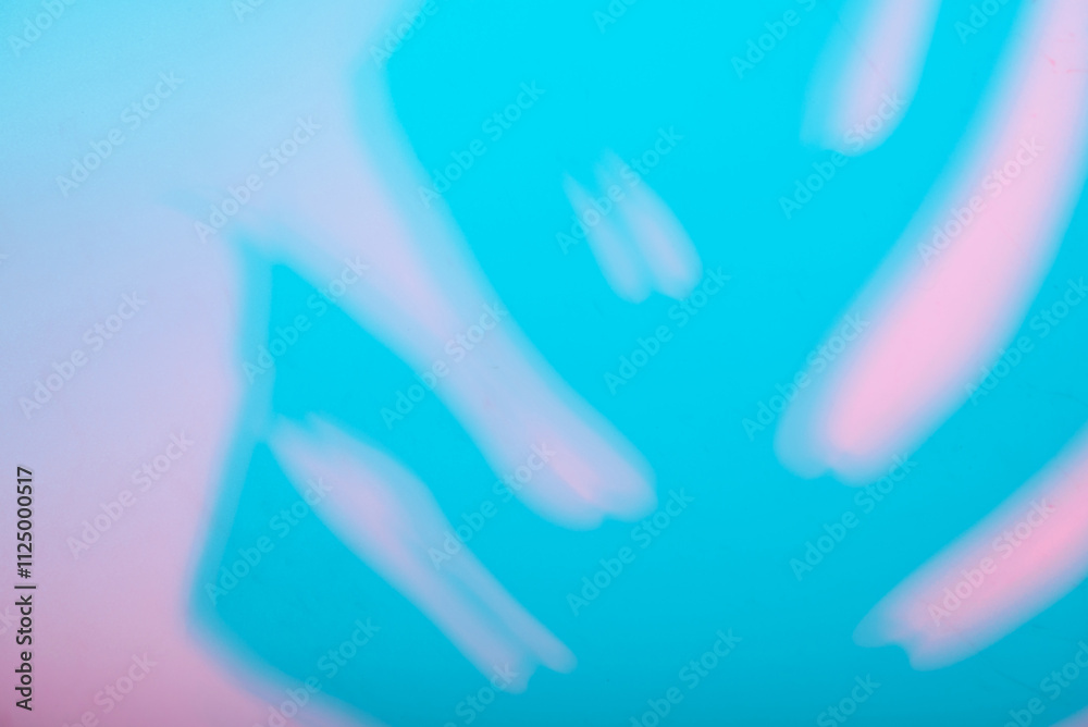 Blurred hands on vibrant blue and pink background Blurred hands on vibrant blue and pink background