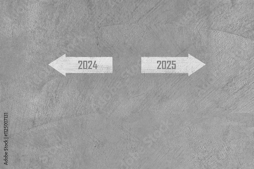 year number 2024 and 2025 arrows painted on grey concrete floor, past and future choices