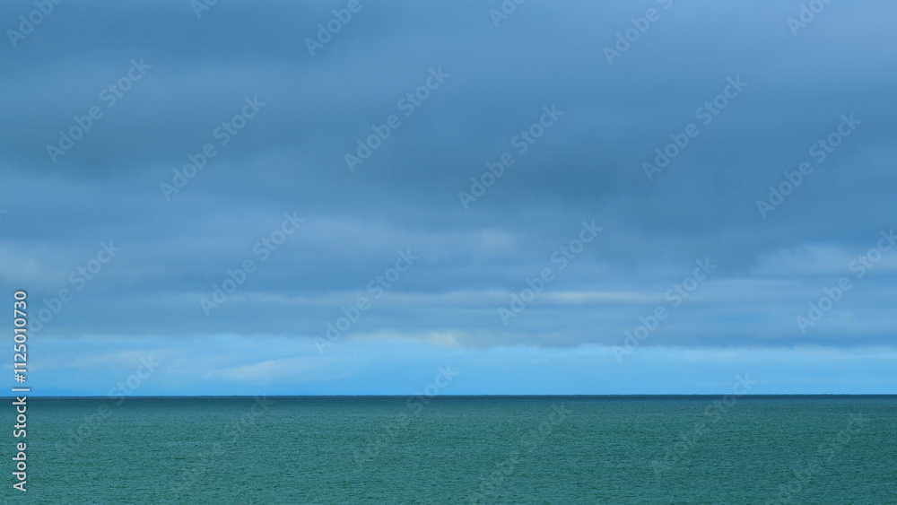 Obraz premium Sea And Sky Before The Rain. Heavy Precipitation And Tropical Cyclone. Signs Of The Coming Rain. Still.