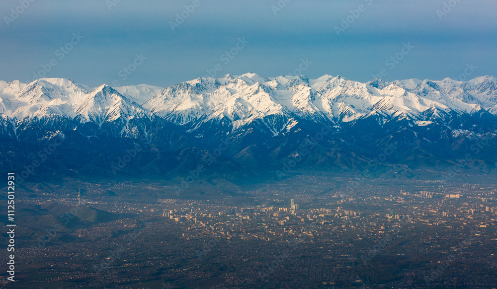 Fototapeta premium View from an airplane of Almaty, the largest city and southern capital of Kazakhstan.