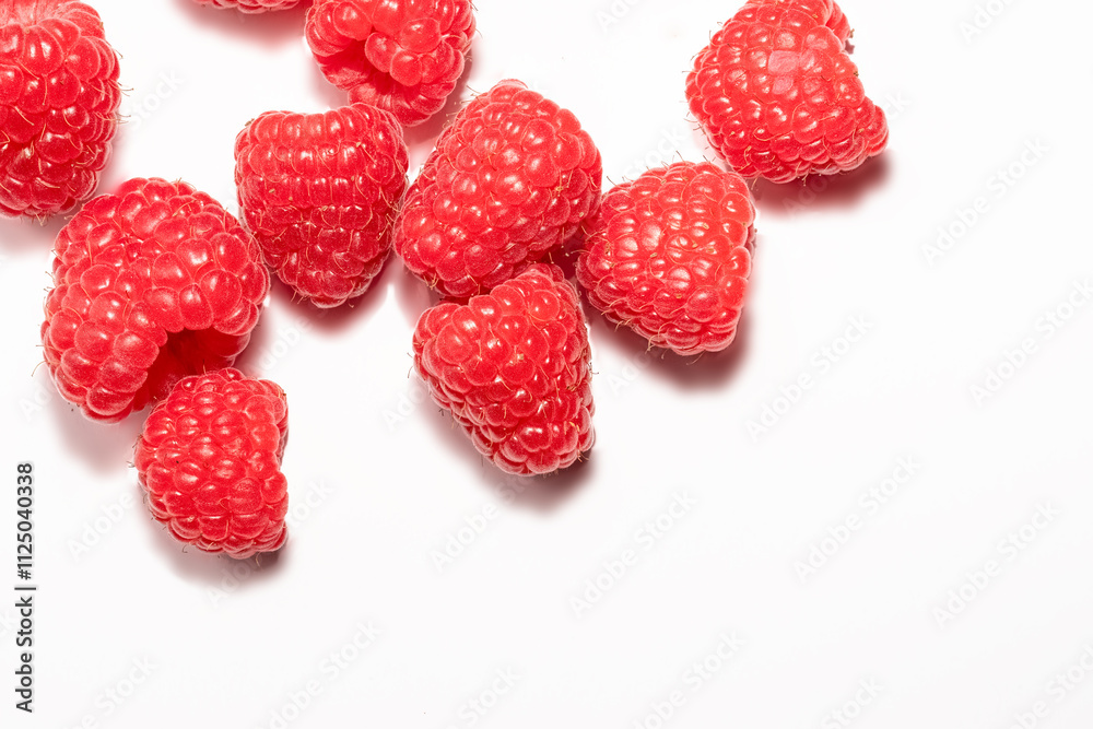 Ripe juicy raspberries close up on white background Ripe juicy raspberries close up on white background