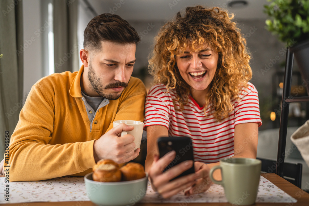 Happy couple have breakfast and cup of coffee at home morning routine Happy couple have breakfast and cup of coffee at home morning routine