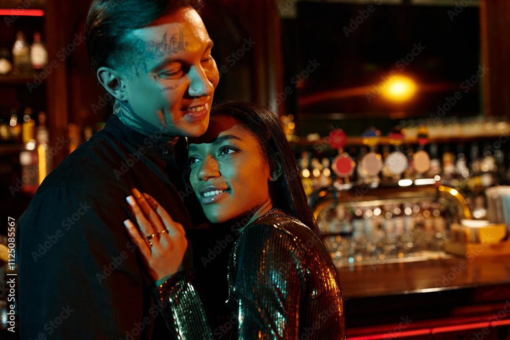A young couple shares laughter and affection in a lively bar, celebrating their date night together.