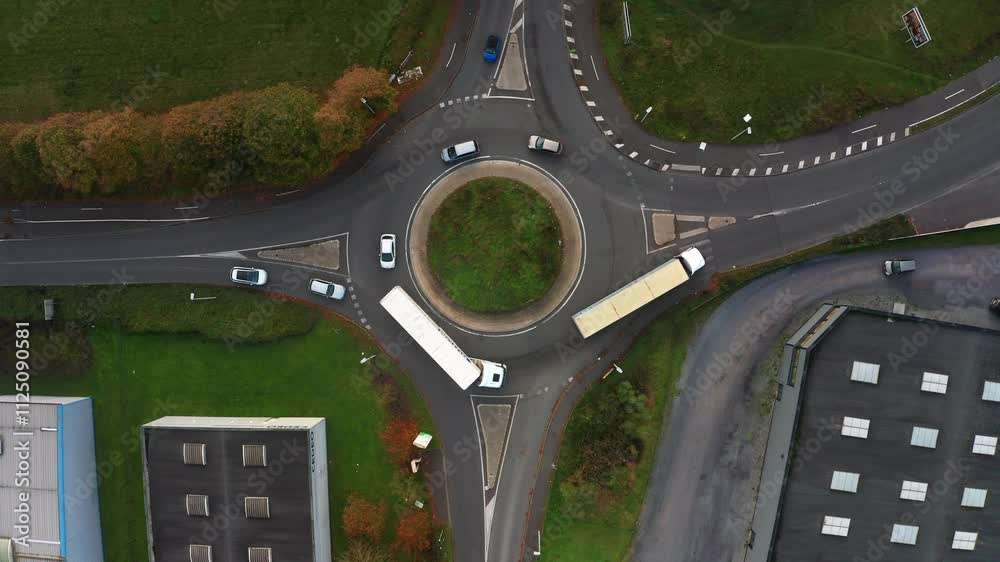 prise de vue aérienne d'un petit rond point avec de la circulation dans une zone industrielle dans le nord de la France
