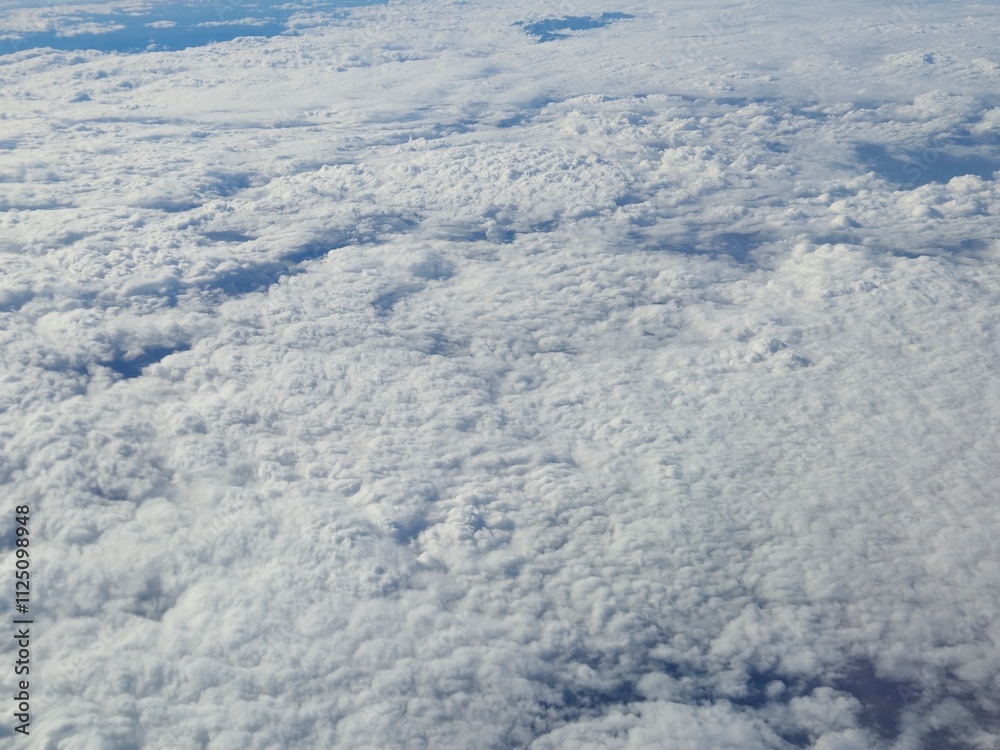 Airplane flying over white clouds background Airplane flying over white clouds background