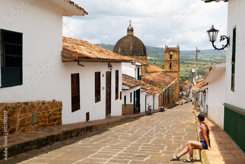 The girl who is travelling through the Colombia is enjoying the view of Barichara which is one of Colombia's most beautiful Heritage Towns.