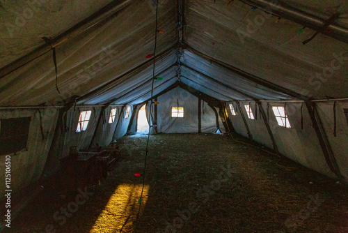 Cozy Army Tent Interior Illuminated by Winter Sunlight