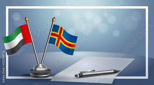 United Arab Emirate and Aland Islands National flags on small table with bokeh background, cooperative relationship