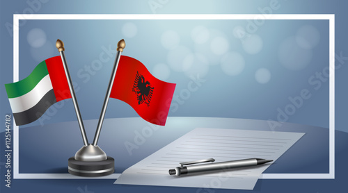 United Arab Emirate and Albania National flags on small table with bokeh background, cooperative relationship