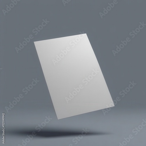 A blank sheet of paper floating in the air against a grey background, ideal for creative designs and templates.