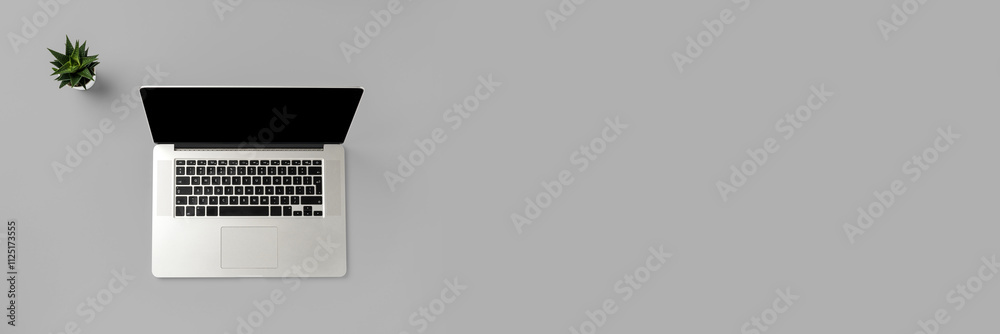 Office desktop with modern laptop. Close up