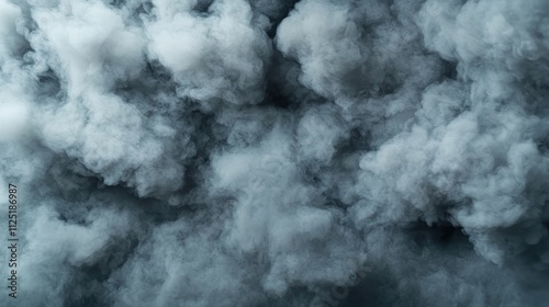 A dramatic and dense formation of dark, thick clouds creates an intense and moody abstract background, conveying a sense of mystery and depth.