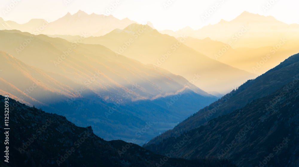 mountain gorge illuminated by sunlight with different gradients