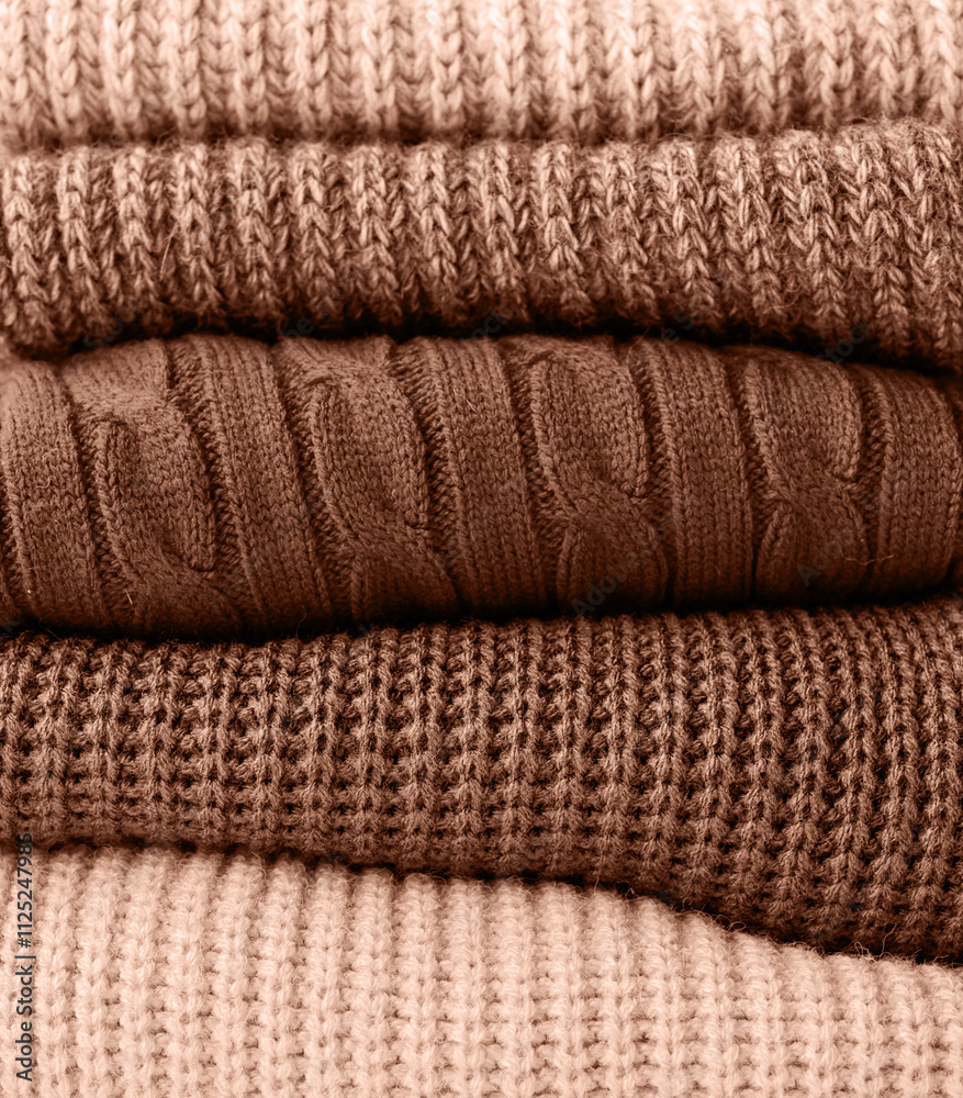 Mocha Mousse - color of the year 2025. Stack of autumn warm sweaters Mocha Mousse - color of the year 2025. Stack of autumn warm sweaters