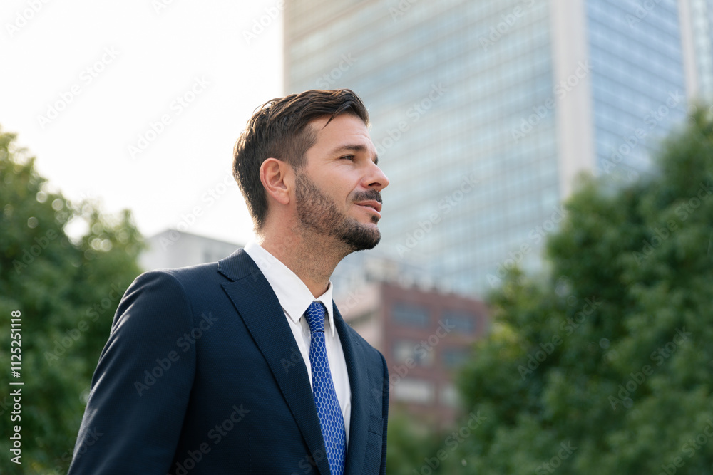 Businessman standing among tree and building in modren city, ESG Environmental, social, and governance ecology business and sustainability environment Businessman standing among tree and building in modren city, ESG Environmental, social, and governance ecology business and sustainability environment