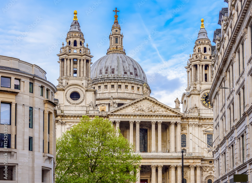 St. Paul's cathedral and double-decker buses on streets of London, UK St. Paul's cathedral and double-decker buses on streets of London, UK