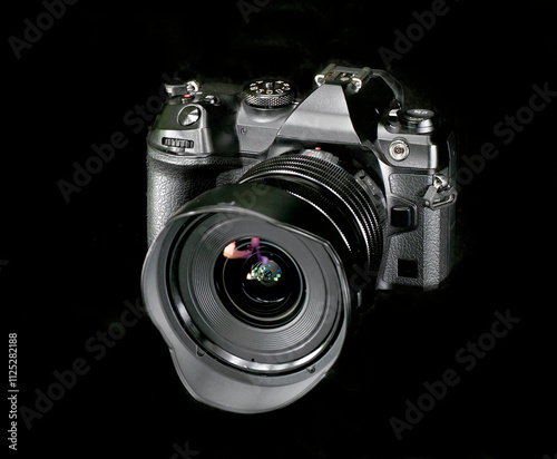 A State of the Art Mirrorless Camera on a Black Background photo