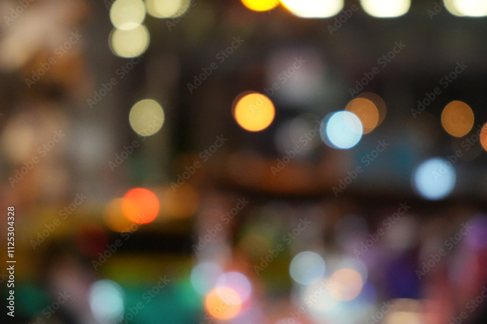 Blurred view of street with lights at winter rainy night. Bokeh lights background. Abstract artistic photography. Blurred view of street with lights at winter rainy night. Bokeh lights background. Abstract artistic photography.