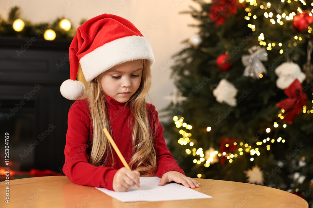 Little girl writing letter to Santa Claus at table indoors. Christmas celebration Little girl writing letter to Santa Claus at table indoors. Christmas celebration