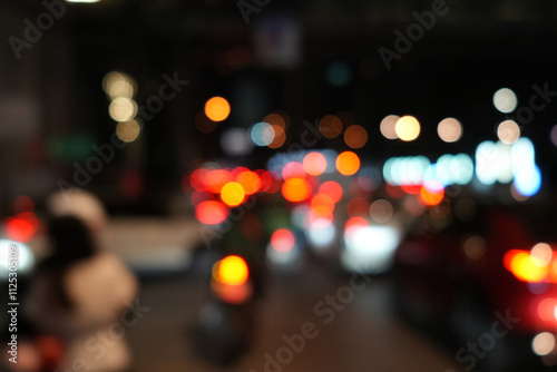 multi color bokeh light background . Bokeh light in the night road .colorful bokeh of city light at night, landscape background . Blur view of city traffic . black blure background