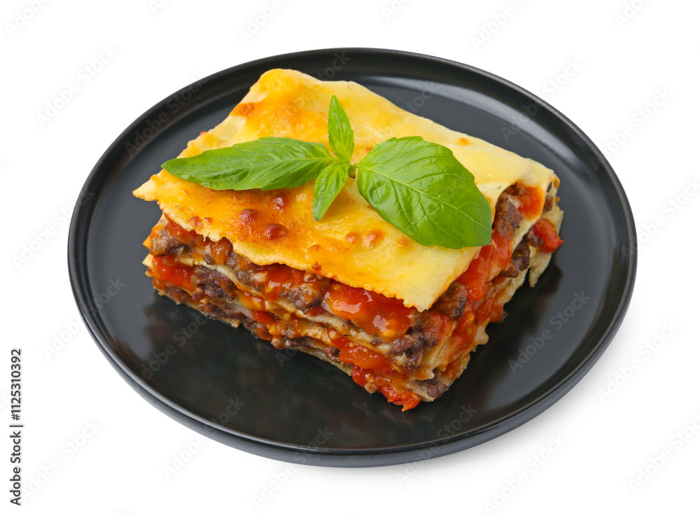 Delicious cooked lasagna with basil isolated on white Delicious cooked lasagna with basil isolated on white