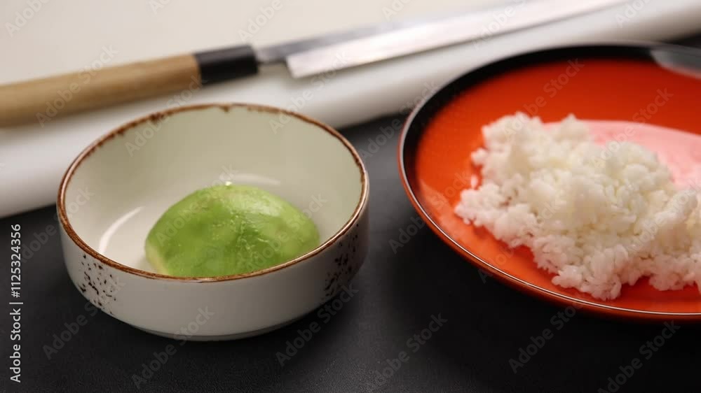 the chef cooks delicious salmon rolls. Japanese cuisine