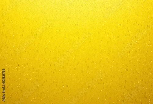 water drops falling onto a perfectly flat, yellow surface