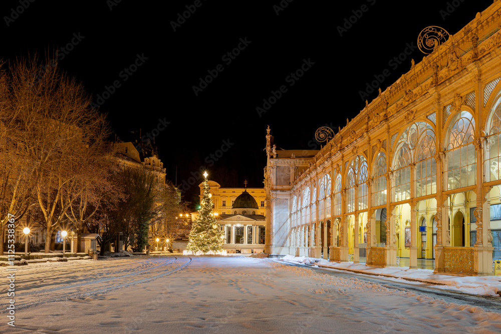 Snow winter in Czech spa town Marianske Lazne (Marienbad) - Main colonnade and white pavilion with Christmas tree - Czech Republic