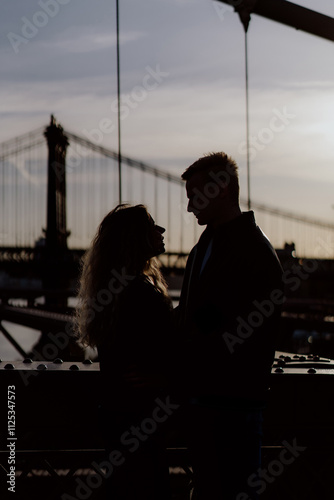 Romantic Silhouette Featuring a Beautiful Bridge as a Background Scene