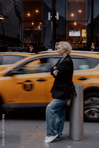 Chic Urban Style featuring a Yellow Taxi enthusiastically in Motion cityscape