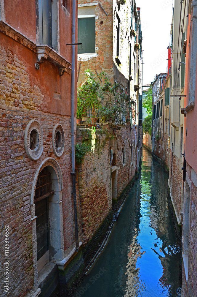 Narrow canal in the old part of Venice Narrow canal in the old part of Venice