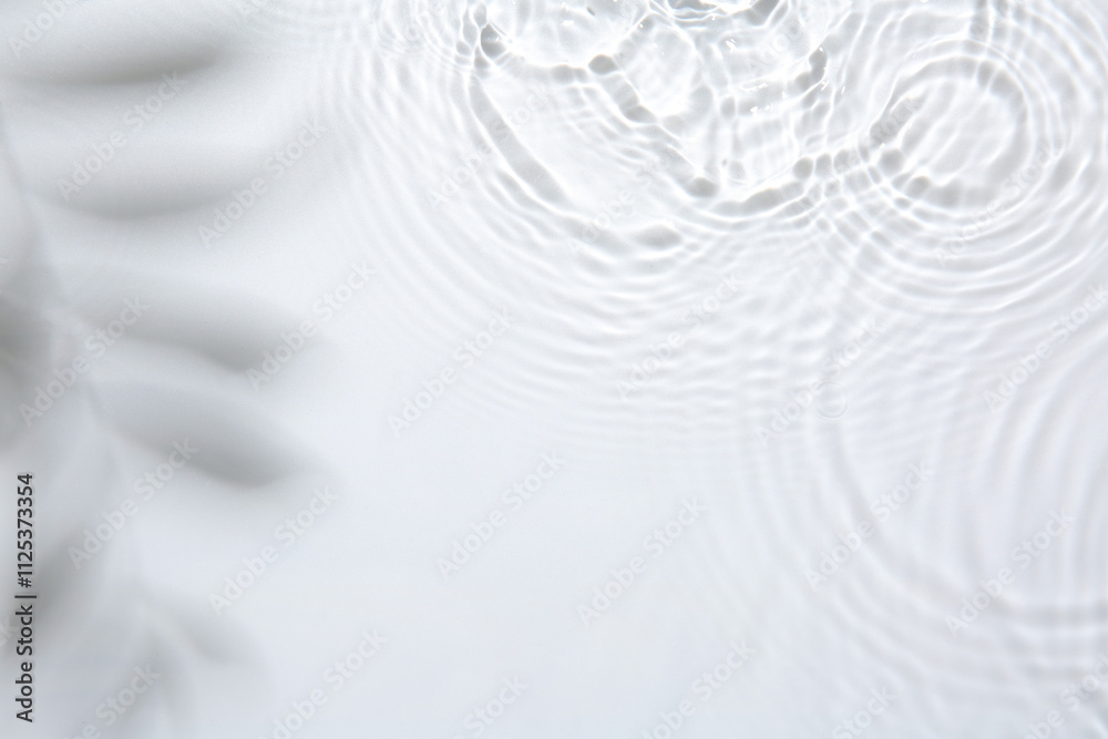 Rippled surface of clear water on white background, top view Rippled surface of clear water on white background, top view