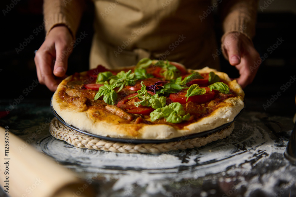 Freshly baked homemade pizza with basil and tomatoes Freshly baked homemade pizza with basil and tomatoes