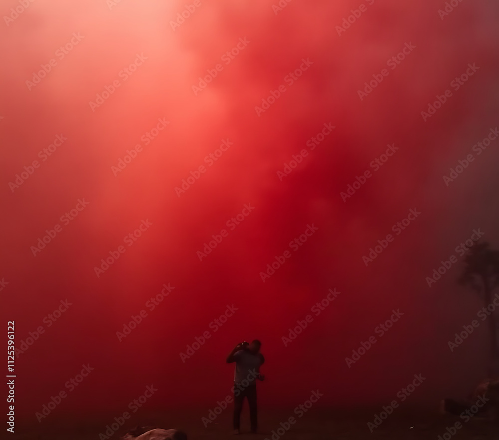 Fototapeta premium Slowly rising red smoke in realistic atmospheric conditions creates a dramatic and immersive visual effect._00001_