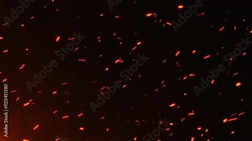 Bright hot fire sparks moving fast with the wind surrounded by smoke and blaze. Fire particles rising up. Big firestorm, wildfire, and disaster. Burning bonfire ashes closeup. Glowing fire embers. 4k.