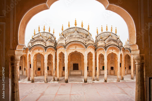 Stone arches and carved collumns of ancient house in, Rajasthan, India