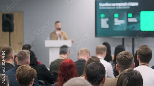 Wallpaper Mural Audience at business conference focused on speaker's presentation. Engaged attendees listening attentively. Torontodigital.ca